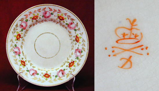 Fig. 5 A Derby dessert dish c. 1820, with a border of gilded foliage, half hearted daisies and skilfully executed roses.