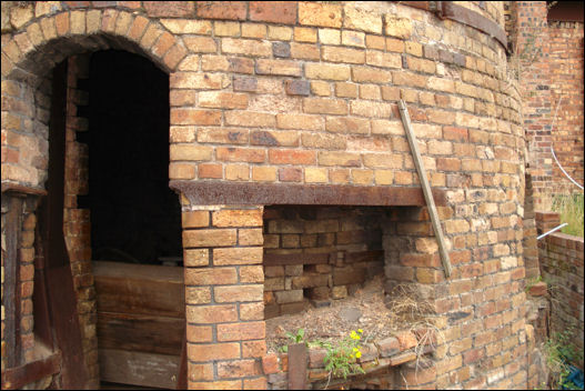 The outer hovel with the inner kiln visible through the door and openings